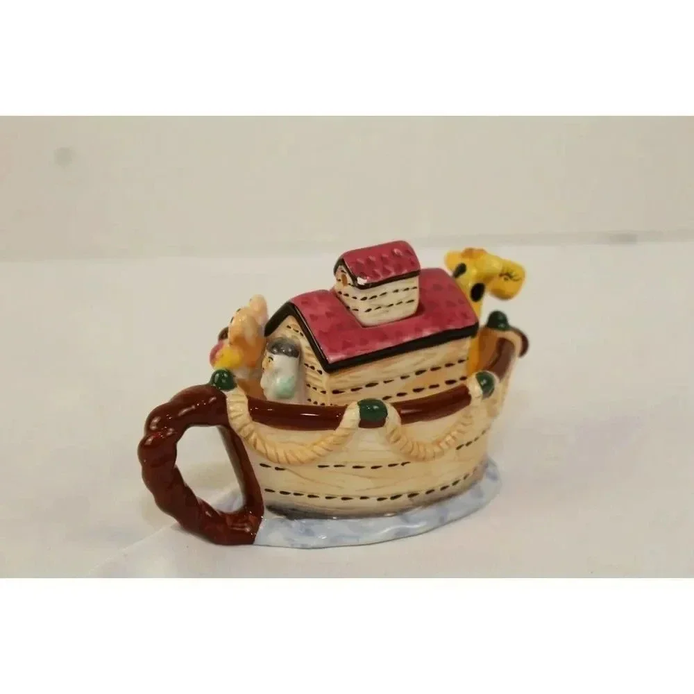 vintage animals in the boat tea pot